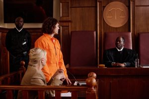 side-view-of-suspect-in-orange-jumpsuit-and-his-at-2025-02-11-15-41-13-utc-min