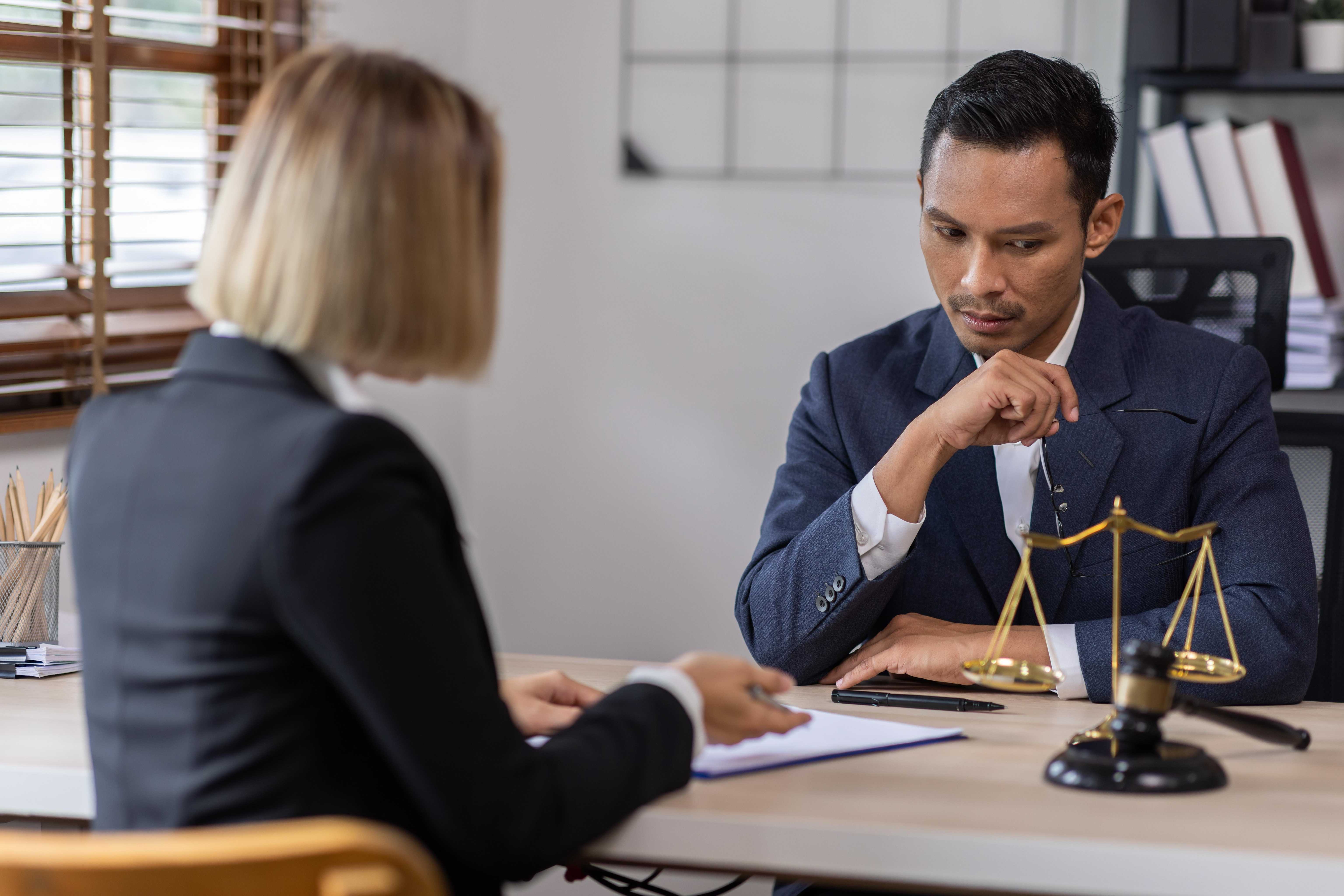 businessman talking to a lawyer
