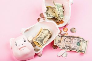 broken piggy bank with money inside