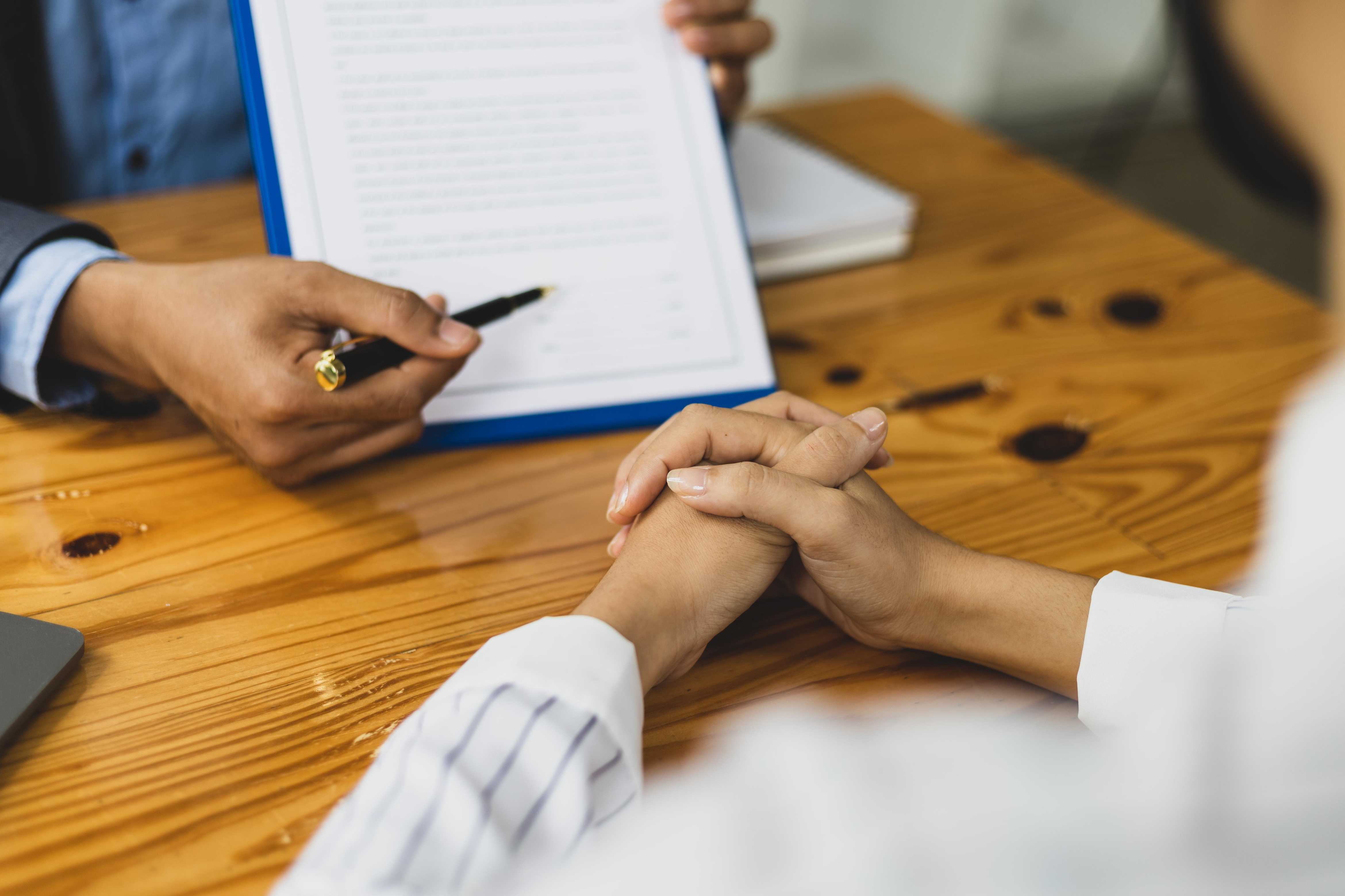 Insurance agent asking customer to sign release claims