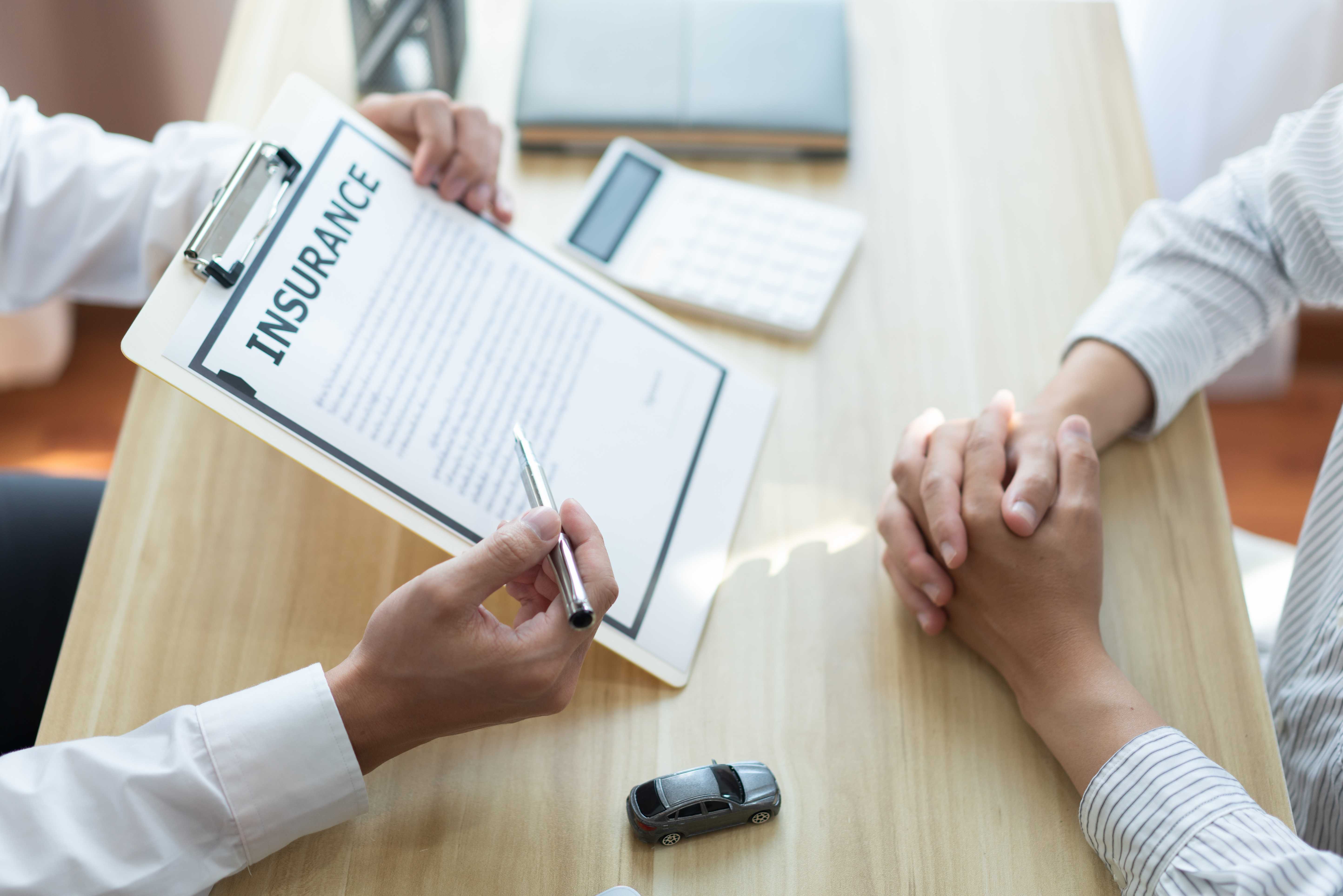 auto insurance agent talking to client