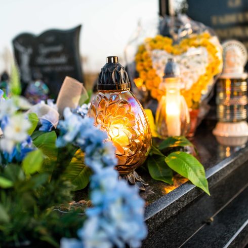 candles and flowers for lost loved ones