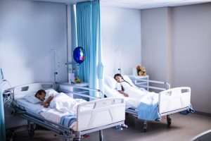 Patients Sleeping On The Bed At Hospital
