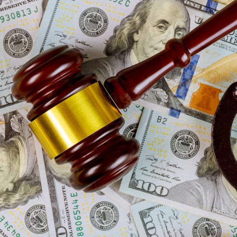 Lawyer and court judges gavel with corruption concept