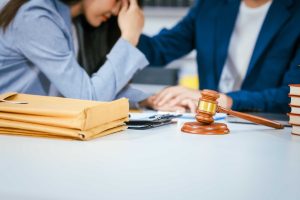 couple consulting lawyer for malpractice claims
